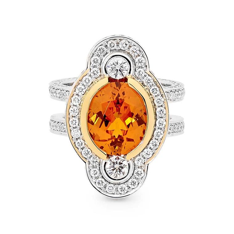 Linneys ring in white and yellow gold with a central spessartite and diamonds.